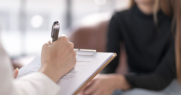 the doctor fills out the patient's documents